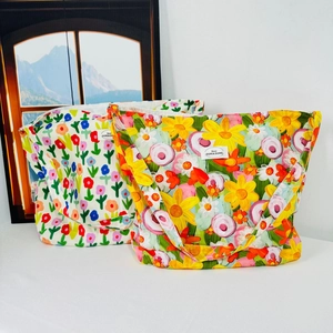 Detailed comparison of two floral canvas tote bags with vibrant oil painting style patterns