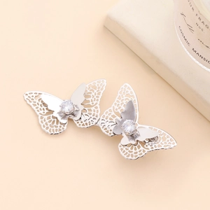 Silver butterfly hair clip with cubic zirconia inlay in a minimalist hollow metal design