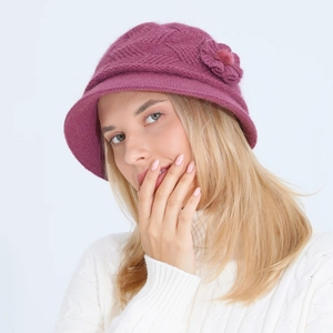 Detail of magenta knitted bucket hat with 3D floral accent and soft fleece lining