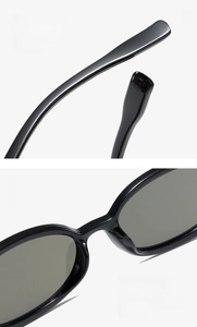 Detail view of oval sunglasses featuring curved temples and integrated nose pads