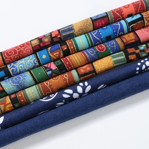 Detail showing ethnic style fabric wire hair ties with diverse floral patterns and textures
