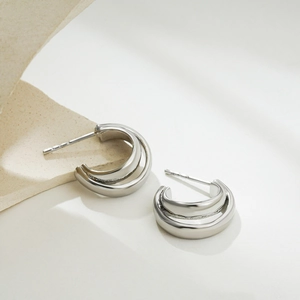 Minimalist silver dual-layer C-shaped stainless steel earrings on a clean white background