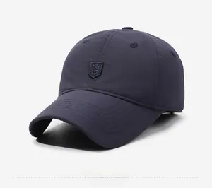 Side view of dark blue winter baseball cap with reinforced brim and shield logo