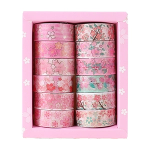 Detail view of 12 rolls pink cherry blossom washi tape set with gold foil accents
