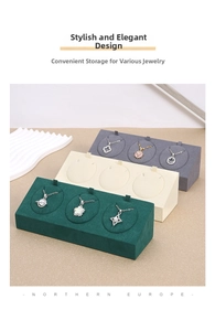 Three-slot microfiber necklace display stands in dark green, beige, and dark grey tones