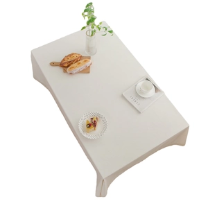 Beige cotton linen rectangular tablecloth with natural texture on a white background