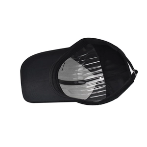 Detail of black baseball cap with inner support and adjustable strap on white background