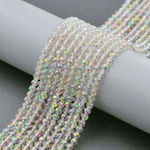 Macro shot of 4mm faceted iridescent crystal glass beads showing 96-cut surface details