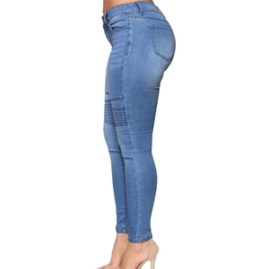 Side view of slim fit light blue ripped denim jeans showing body-shaping effect