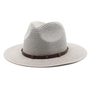 Classic woven straw panama hat with brown leather band and bronze cross metal decoration