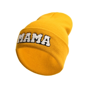 Close-up of yellow knit beanie featuring white MAMA letter embroidery and soft texture