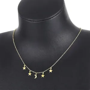 Elegant gold celestial necklace featuring a diamond-studded moon and four star charms
