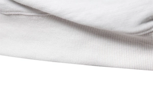 Macro shot of high-quality white knitted fabric texture on loose casual crewneck sweatshirt