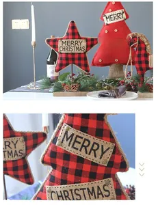 Close-up of buffalo plaid fabric Christmas tree and star ornaments with burlap details