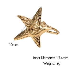 Detail of 18k gold starfish ring showing 19mm outer diameter and spiral metal texture