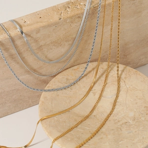 Three-layer stainless steel necklace set with snake and rope chain in gold and silver