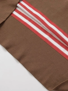 Detailed close-up of premium brown knit fabric with classic red and white stripes