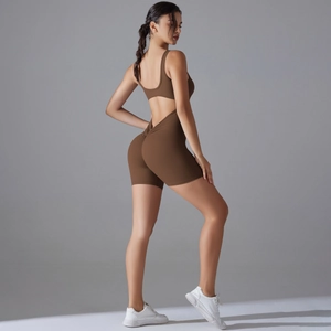 Close-up of ruched back detail and V-shape waist on brown athletic yoga bodysuit