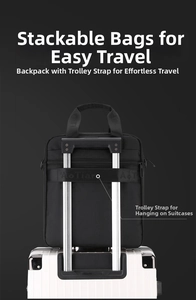 Vertical briefcase with back luggage strap shown attached to a suitcase handle
