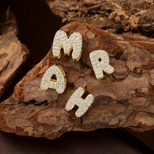 Golden bubble letter pendants M A H R with sparkling zircon pavé on natural bark