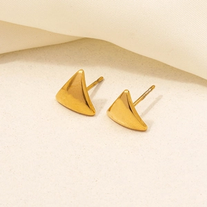Macro shot of minimalist gold triangular stud earrings with high-polished mirror finish