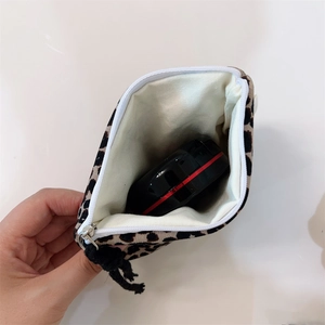 Internal view of leopard print cotton pouch showing capacity for cosmetics and zipper detail