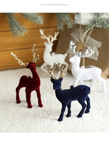 Detailed view of four colorful flocked reindeer ornaments with sparkling glitter antlers