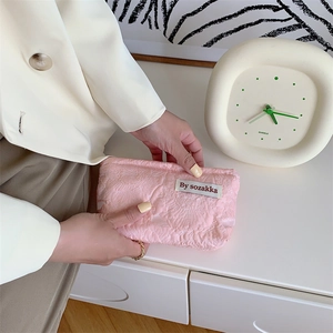 Close-up of pink jacquard floral pattern on a premium mini cosmetic storage bag