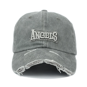 Close-up of ANGELS 3D embroidery on dark gray washed baseball cap with distressed brim