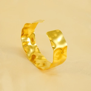 Minimalist hammered texture gold cuff bracelet with adjustable wavy irregular design
