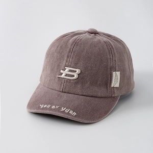 Close-up of the grey-purple corduroy baseball cap with letter B embroidery and fine texture