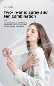 Pink handheld mist fan showing cooling water spray detail with a minimalist design