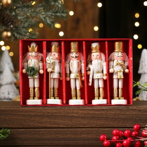 Detailed set of five white and gold wooden nutcracker soldiers in a festive red gift box