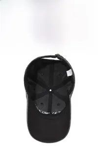 Detail of washed cotton baseball cap showing internal sweatband and metal adjustment buckle