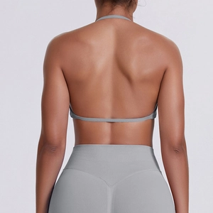 Detail of grey racerback sports bra and high-waisted leggings showing back lines