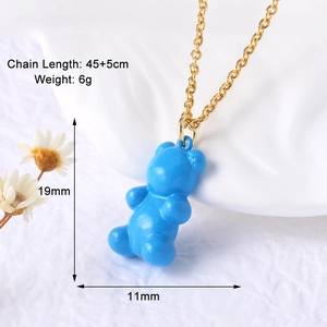 Macro shot of gold plated necklace with blue bear pendant dimensions 19mm x 11mm