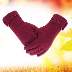 Detail of burgundy thermal winter gloves featuring decorative buttons and soft fleece lining