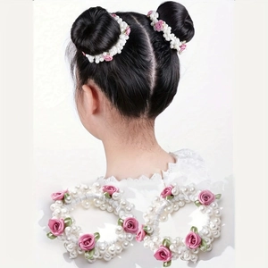Detail of pink fabric rose and white pearls on elastic hair bands for girls