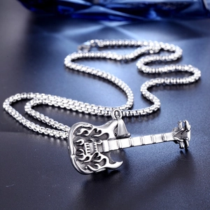 Polished stainless steel flame guitar pendant necklace with silver box chain on dark background