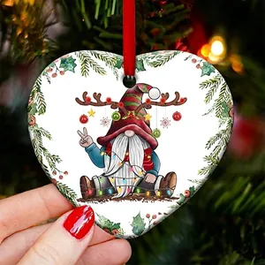 Detailed view of heart-shaped ceramic Christmas ornament with a festive gnome design