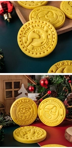 Detailed macro view of yellow round Christmas cookies with festive embossed patterns