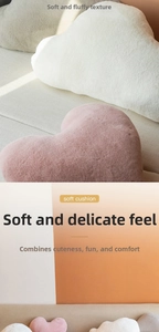 Detail of plush heart and cloud shaped cushions with soft faux rabbit fur texture