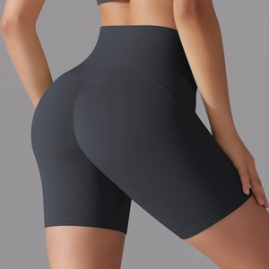 Detail of charcoal grey high-waisted yoga shorts with seamless front and lift stitching