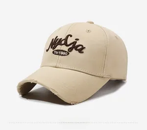 Detailed side view of vintage beige cotton baseball cap with 3D embroidery and distressed brim