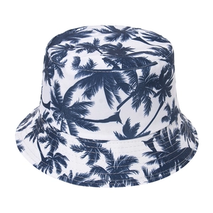 Reversible white cotton bucket hat with dark blue palm tree prints for summer sun protection