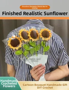 Close-up of handmade crochet sunflower bouquet in clear packaging with yellow petals