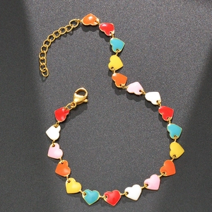 Detail of gold chain bracelet with colorful heart charms and lobster clasp closure
