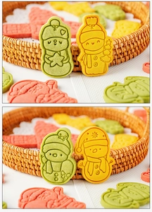 Detail of Christmas snowman cookies with embossed patterns in a rattan tray