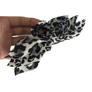 Large leopard print bow hair claw clip for women made of elegant chiffon fabric