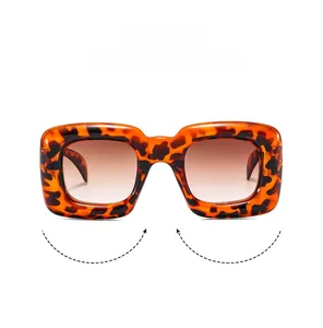 Detail of square bubble sunglasses for kids featuring leopard print frames and brown lenses